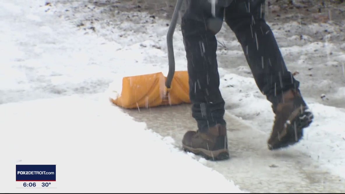Metro Detroiters busy shovel snow during winter storm